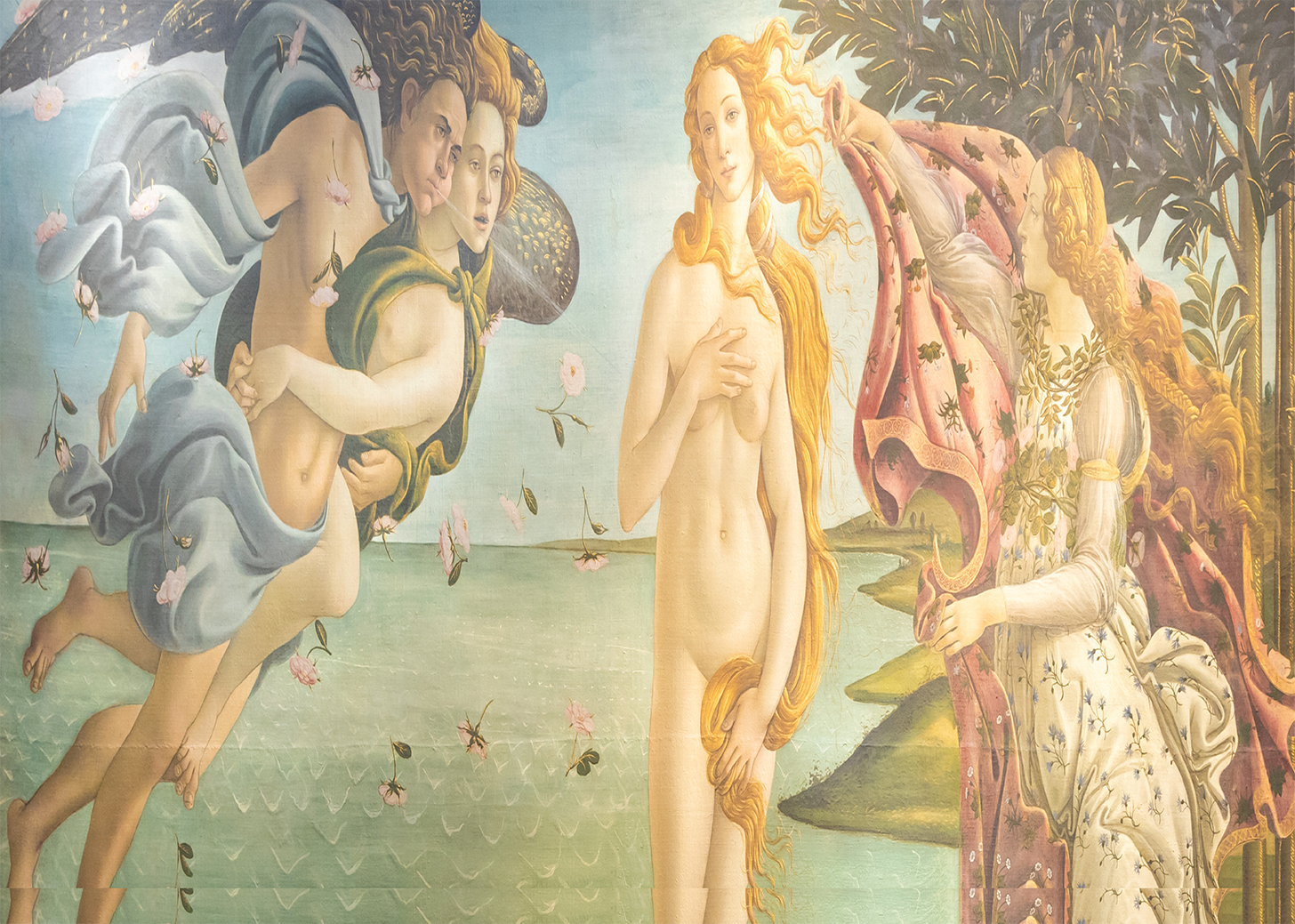 Detail from Botticelli's Birth of Venus: Venus standing with her hair falling across her body, the winged wind gods blowing from the left amid falling roses, and a robed attendant reaching in from the right with a flowered cloak.